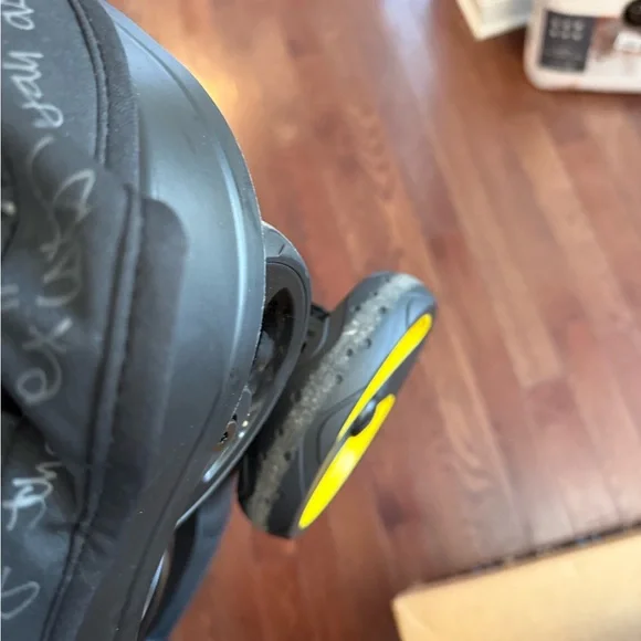 Doona Infant Car Seat & Stroller in Black with Yellow Accents - Picture 6 of 9